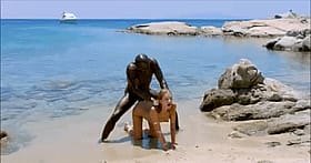 Interracial Public Sex: Two Men Fucking A Woman On The Beach'